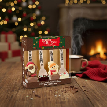 Coffret 4 Hot Choc Le Comptoir de Mathilde édition Noël, représentant des cuillères en chocolat avec des personnages festifs comme le Père Noël et un bonhomme de neige.