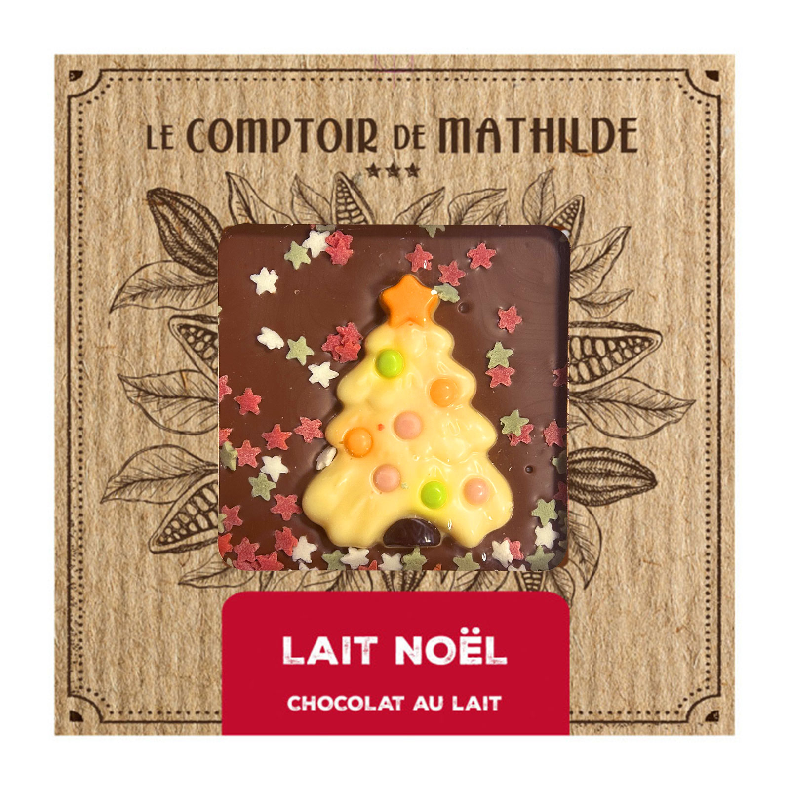 Tablette de chocolat au lait Le Comptoir de Mathilde avec un décor de sapin de Noël, garnie de vermicelles colorés et d'étoiles.