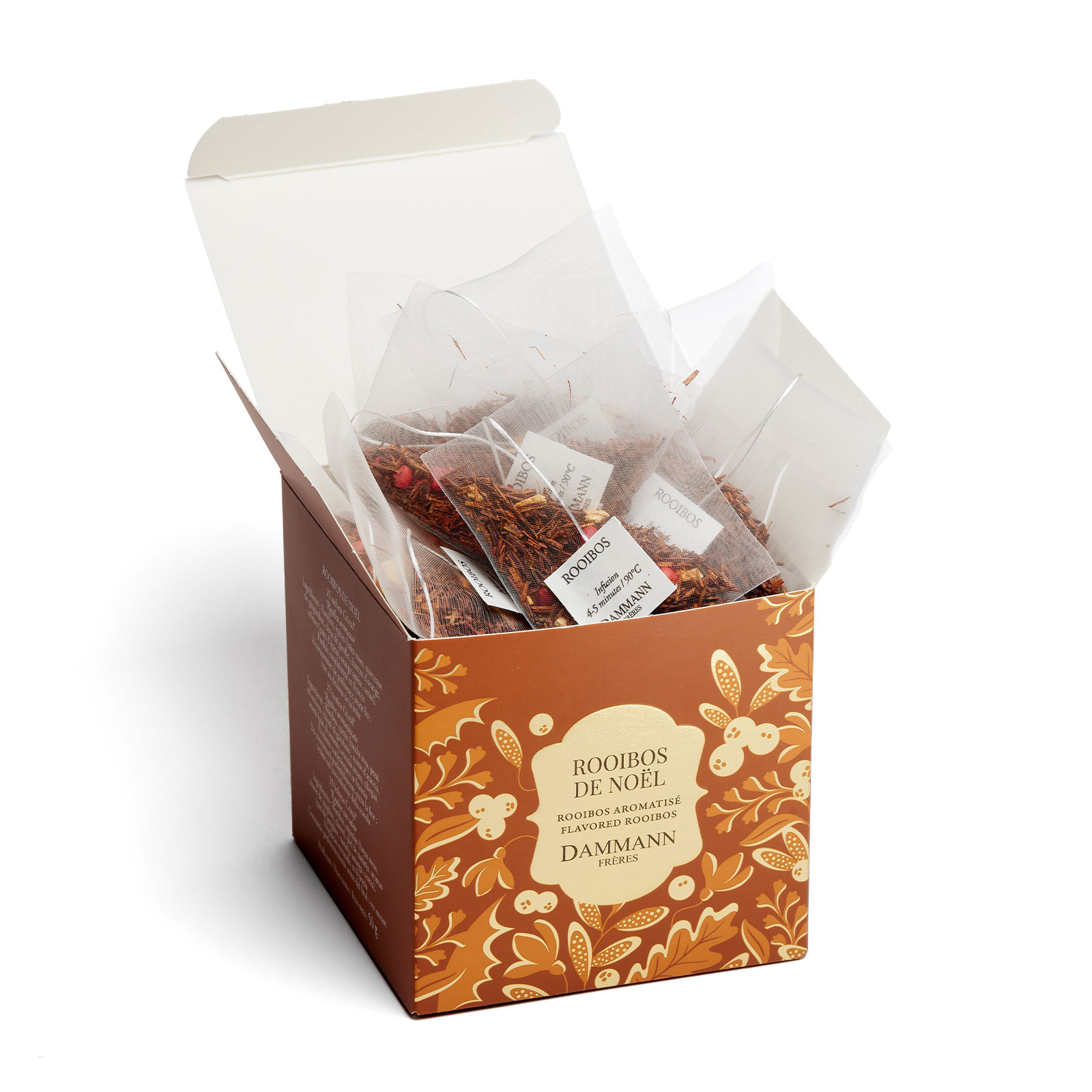 Boîte ouverte de sachets Cristal Dammann Frères Rooibos de Noël, aux notes festives de pain d'épices, orange et cerise
