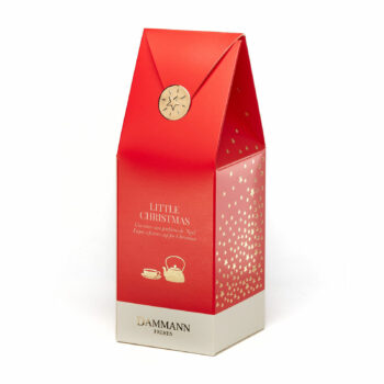 Pochette cadeau Little Christmas de Dammann Frères en rouge vif avec étoiles dorées, contenant un thé noir aromatisé et une gelée de thé.