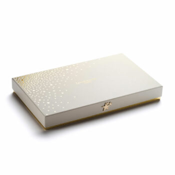 Coffret Dammann Frères Rêves de Noël fermé, avec une finition dorée et un design élégant constellé d’étoiles.