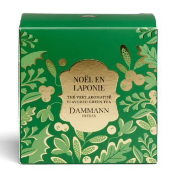 Boîte verte aux motifs dorés de Dammann Frères pour le thé vert aromatisé Noël en Laponie, notes d'orange et cranberry