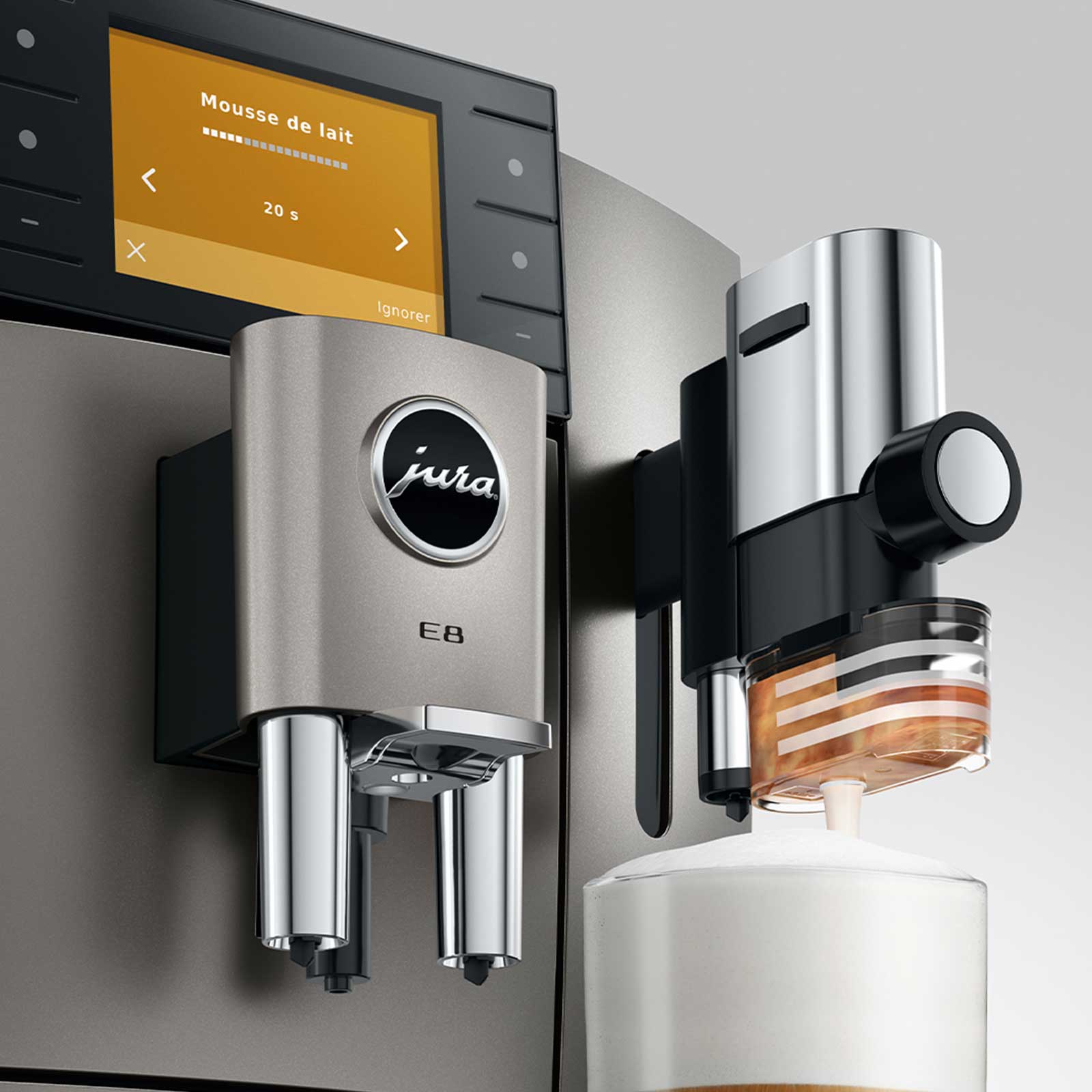 Machine à café Jura E8 Midnight Silver préparant de la mousse de lait, affichant un compte à rebours de 20 secondes sur son écran tactile