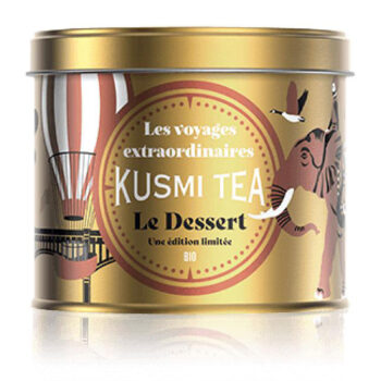 Boîte métallique dorée Kusmi Tea Le Dessert édition limitée BIO 90g, illustrée d'un éléphant et d'un ballon dirigeable