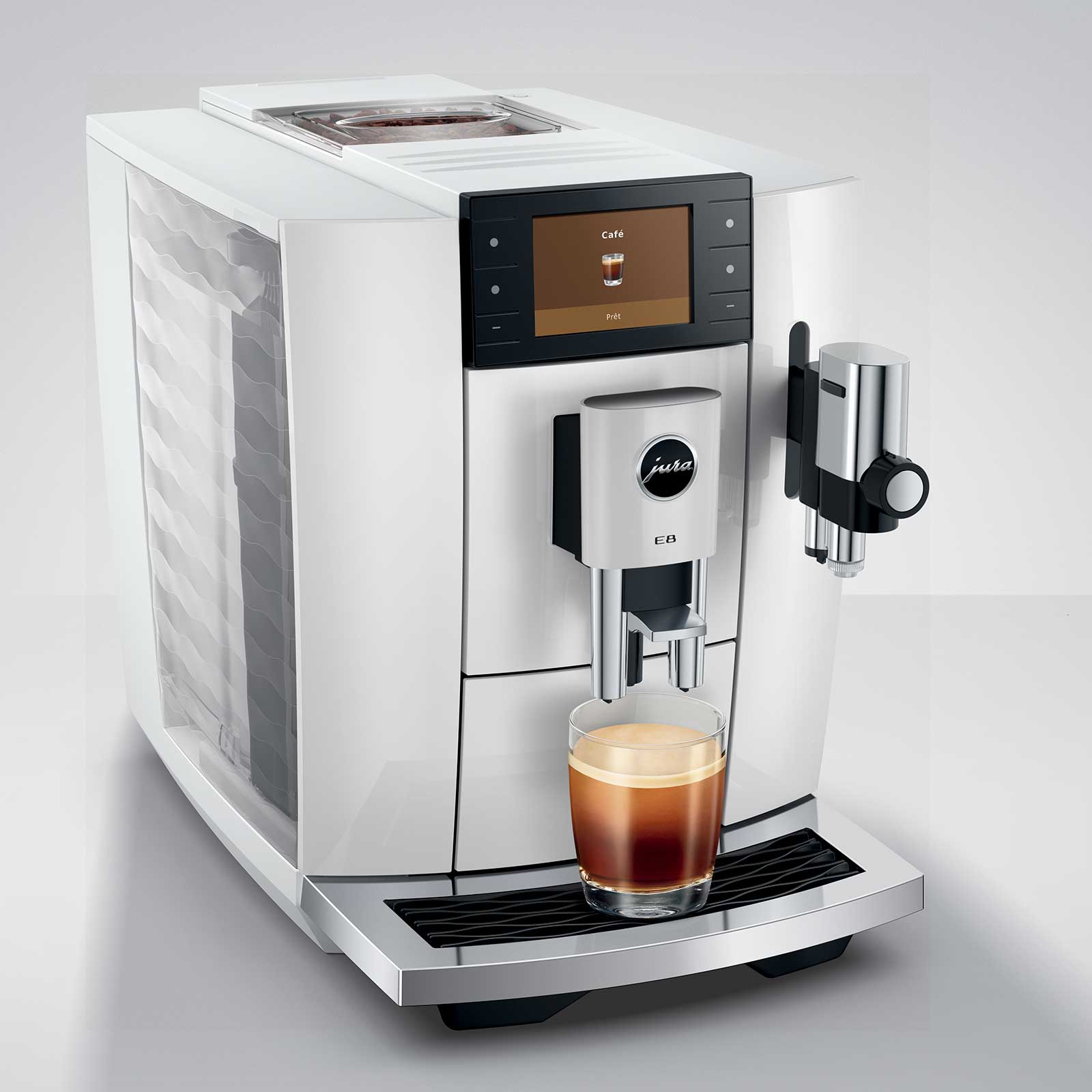 Machine à café JURA E8 Piano White préparant un espresso dans un verre, affichant le logo Jura et le modèle E8