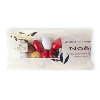 Sachet transparent assortiment de Noël Médicis Paris 50g, dragées festives rouge blanc brun, motifs végétaux dorés et bleus