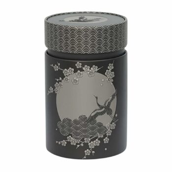 Boîte à thé Eigenart Komorebi anthracite en fer blanc, motif grue et vagues en relief, couvercle géométrique argenté