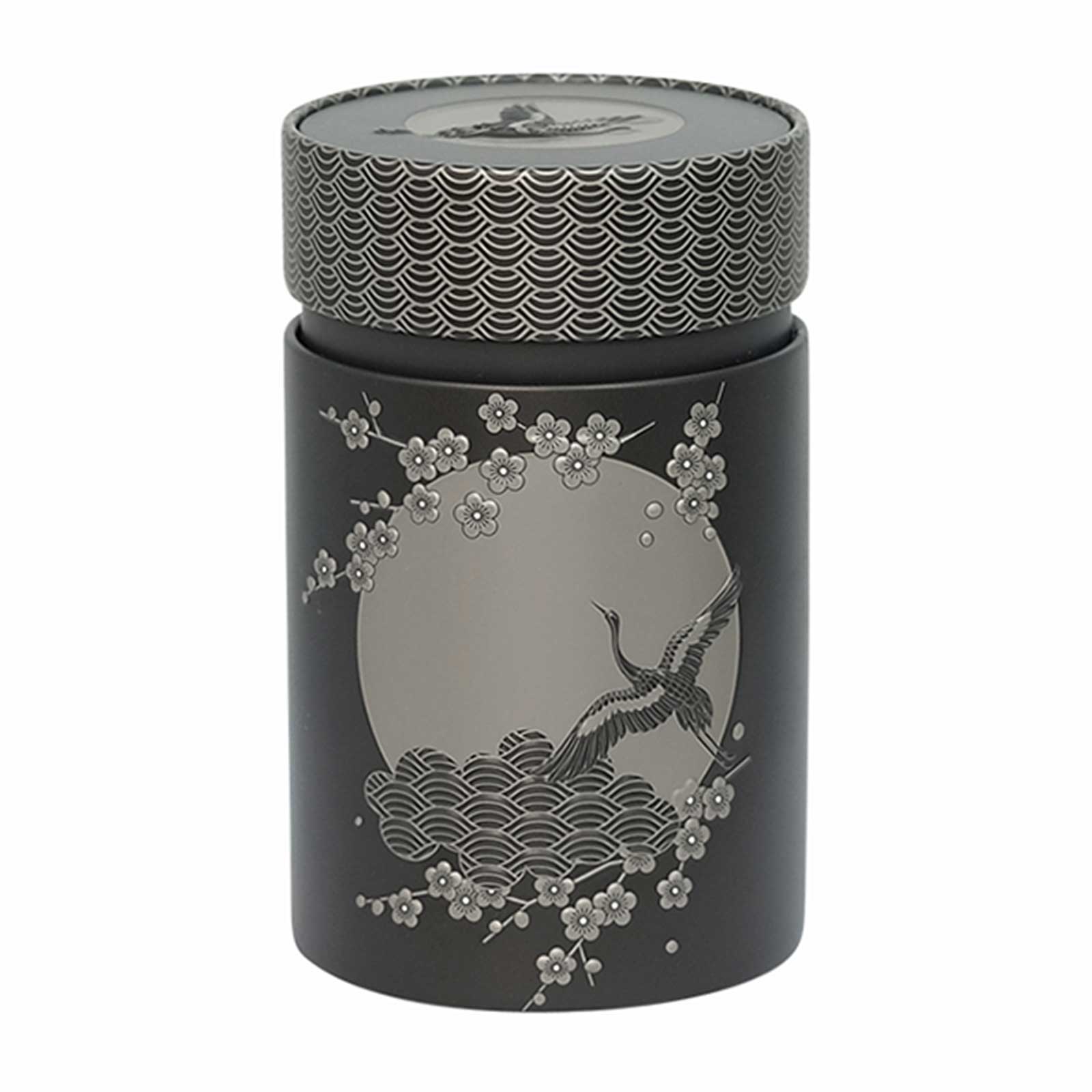 Boîte à thé Eigenart Komorebi anthracite en fer blanc, motif grue et vagues en relief, couvercle géométrique argenté