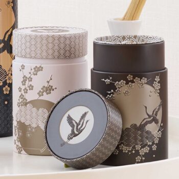 Boîte à thé Eigenart Komorebi anthracite avec motif de grue japonaise et fleurs de cerisier, couvercle décoré de vagues