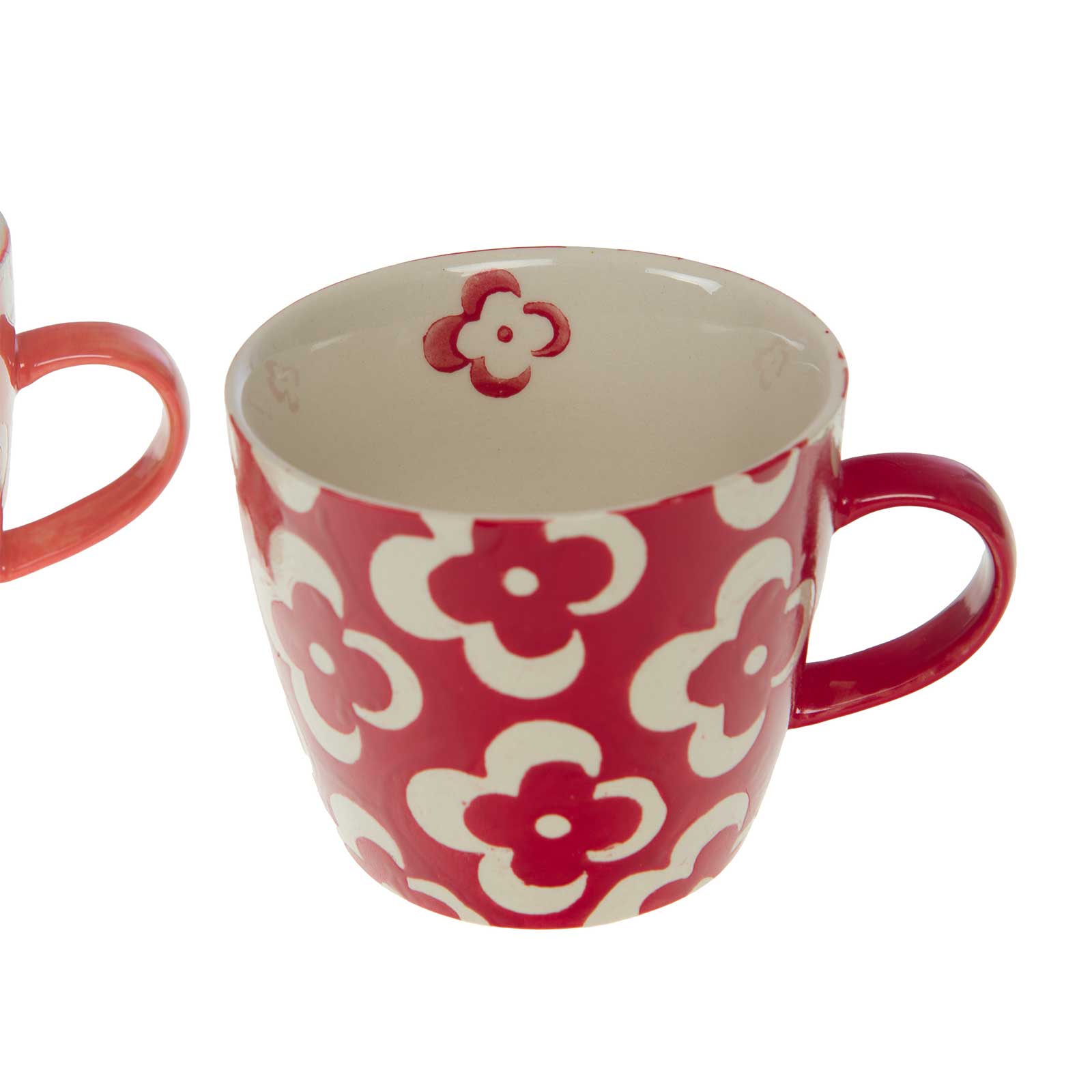 Mug en grès rouge avec un motif floral blanc, anse rouge assortie, intérieur blanc avec une petite fleur rouge