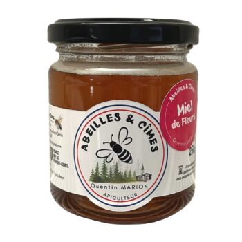 Pot en verre de miel de fleurs Abeilles & Cîmes 250g, couleur ambrée, avec étiquette circulaire et couvercle noir