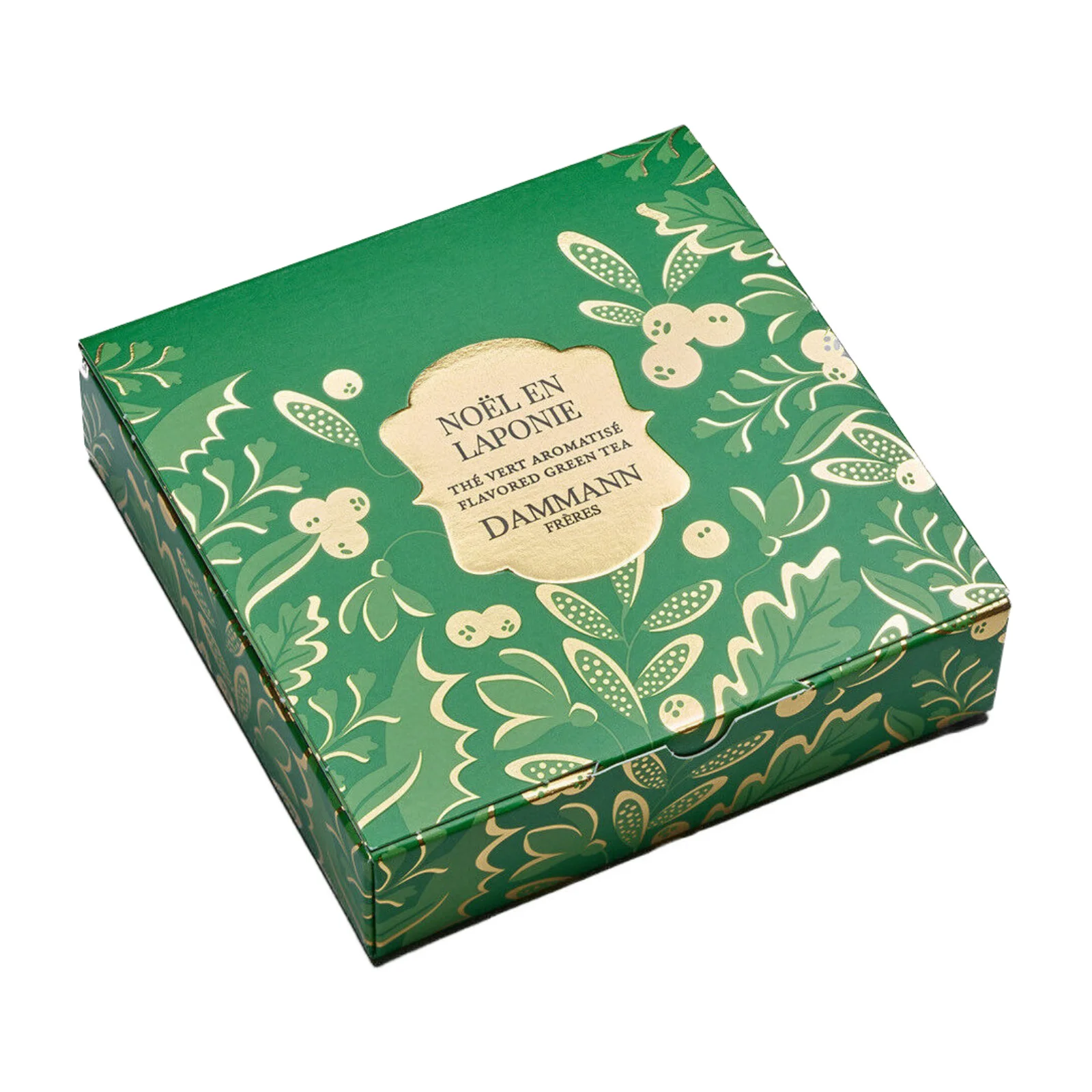 Boîte de thé vert aromatisé Noël en Laponie Dammann Frères, packaging vert orné de motifs végétaux dorés et de baies