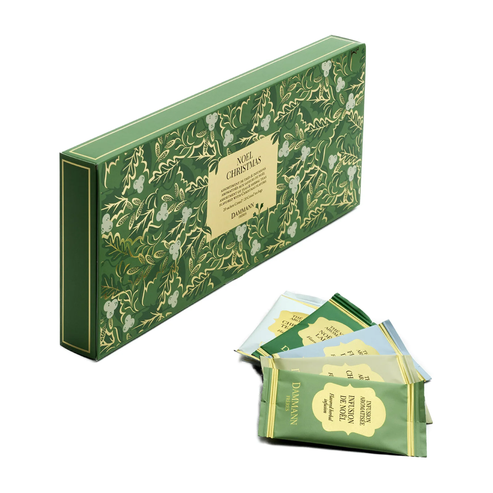 Boite verte décorée de motifs végétaux contenant un assortiment de thés et infusions de Noël Dammann Frères avec plusieurs sachets présentés devant